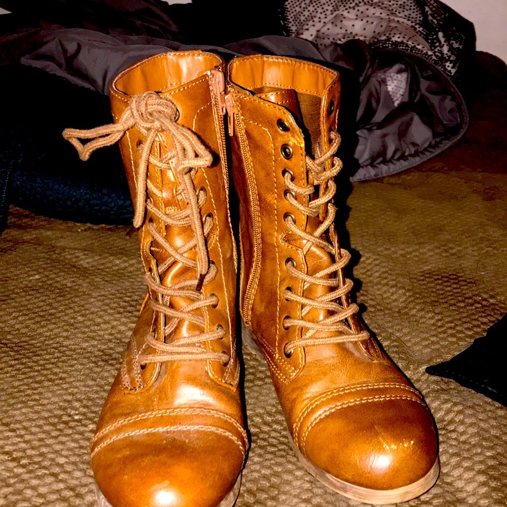 Brown boots, with zip/lace. In good condition